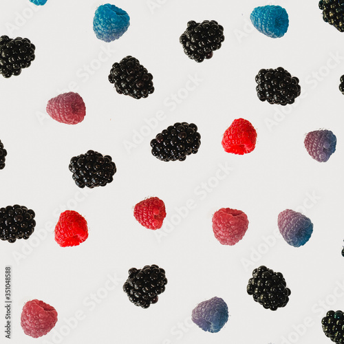 berries and raspberry falling in different colors