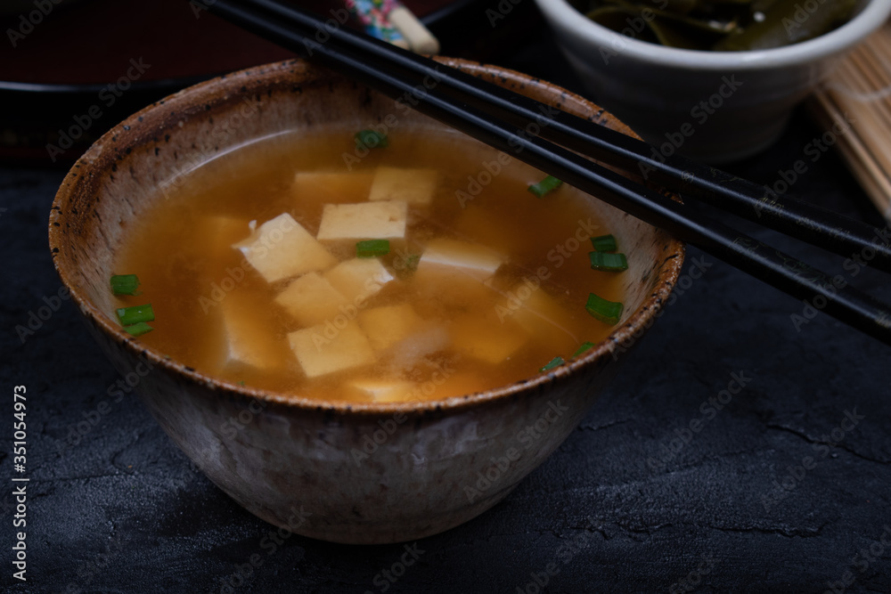 Vegan japanese miso soup with tofu in ceramic bowl Vegan japanese miso soup with tofu in ceramic bowl