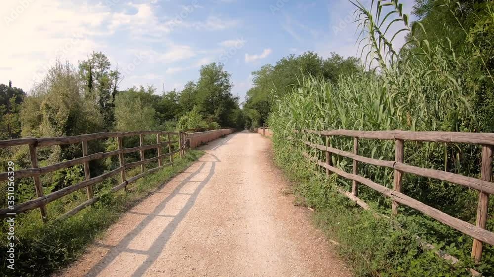pedestrian and cycle path Poggibonsi-Colle along the Elsa river, province of Siena, Tuscany, Italy pedestrian and cycle path Poggibonsi-Colle along the Elsa river, province of Siena, Tuscany, Italy
