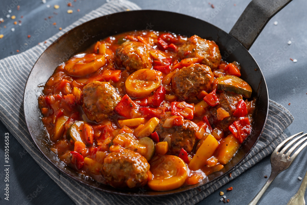 Meatballs with vegetables served on pan Meatballs with vegetables served on pan