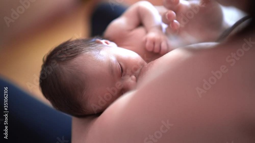 mother breastfeeding her newborn baby