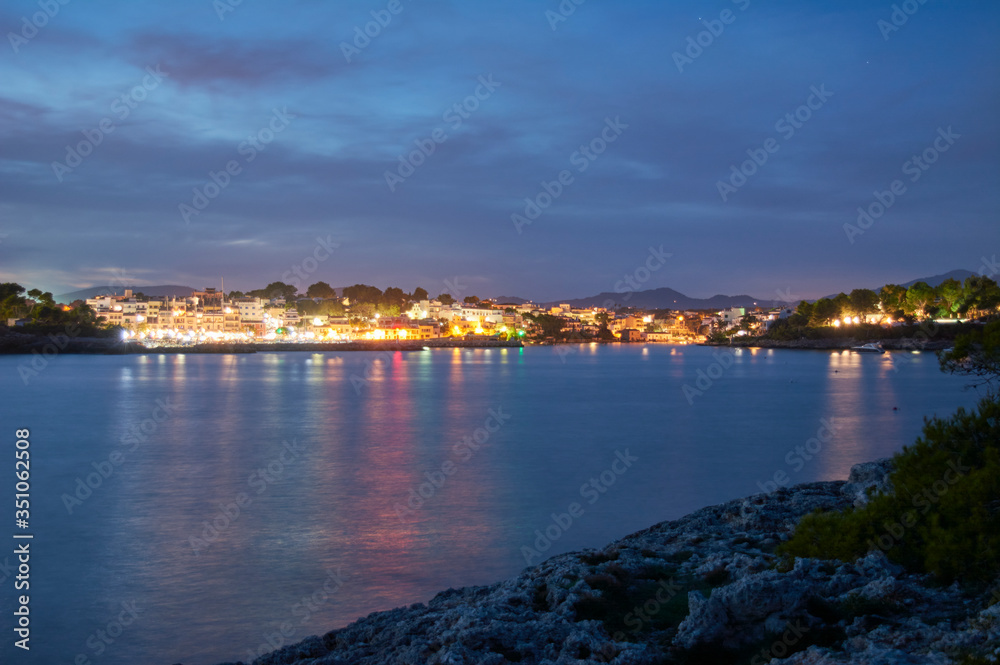 Village of Portopetro, at night as seen from a sailboat in the Marina, Majorca, Balearic Islands, Spain, Europe