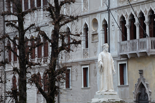 Statue and historical buildings in the city of Feltre