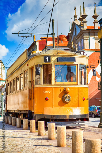 Portugese Travel Destinations. Traditional Porto Yellow Tram on Streets in Portugal.