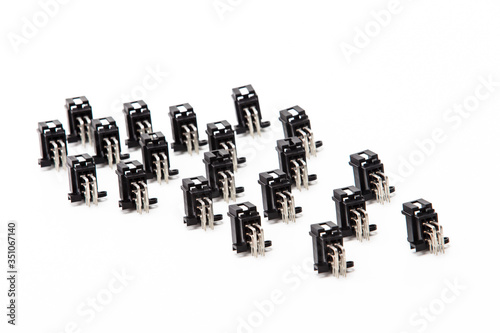 Electronic Components Ideas. Closeup of Rows of Angular PCB Connectors or Terminal Blocks Placed in Lines On White photo