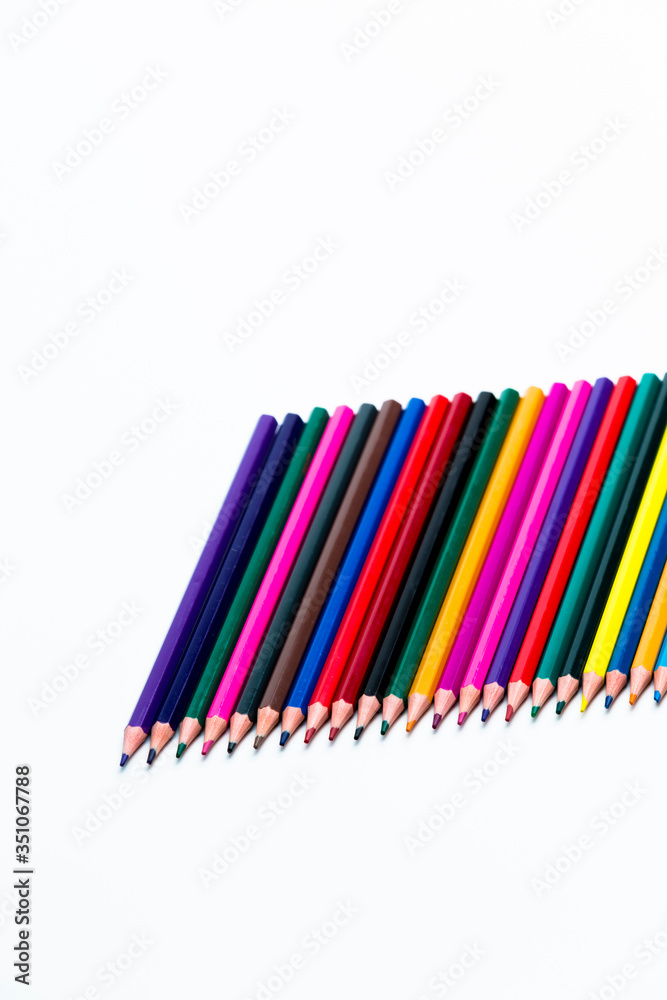 Closeup of  Various Colorful Pencils Placed Together in Row. Isolated Against White.Picture made from Upper View.