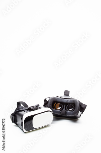 Closeup Of Pair of Virtual Reality Head-On Helmets Placed Together Against White Background