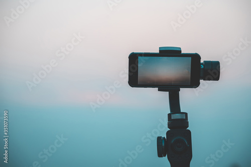 Mobile phones or touch-screen smartphones are fitted with gimbal, electronic image stabilization devices to make video smooth.