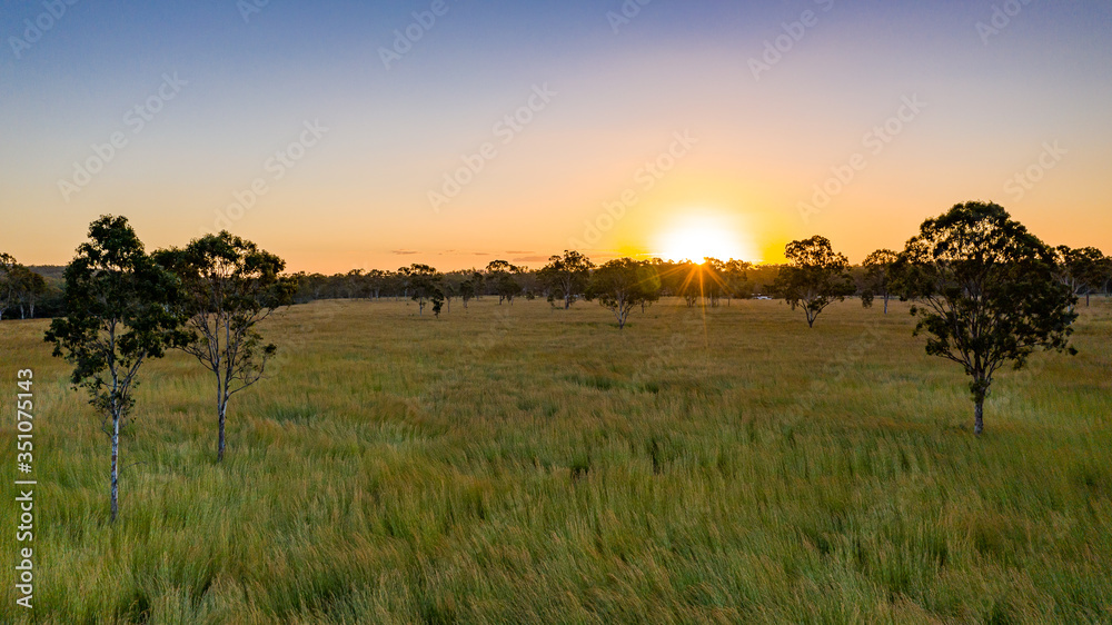 Sunset over farmland in Calliope, Queensland, Australia
