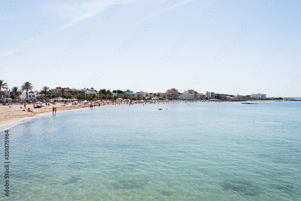 Beach with people and sea landscape in Ciudad Jardin, Majorca