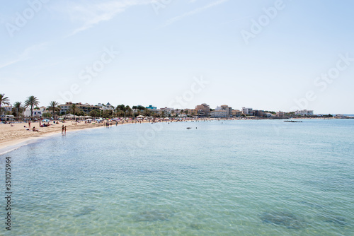 Beach with people and sea landscape in Ciudad Jardin, Majorca