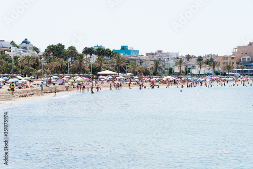 Beach with people and sea landscape in Ciudad Jardin, Majorca © Diego Blanco