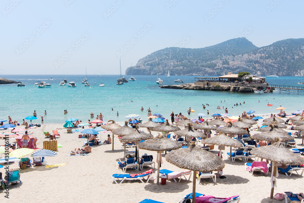Beach with people and sea landscape in Camp de Mar, Majorca