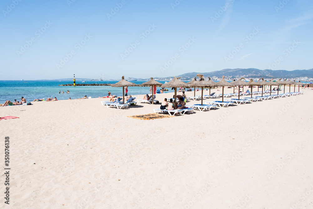 Beach with people and sea landscape in Ciudad Jardin, Majorca