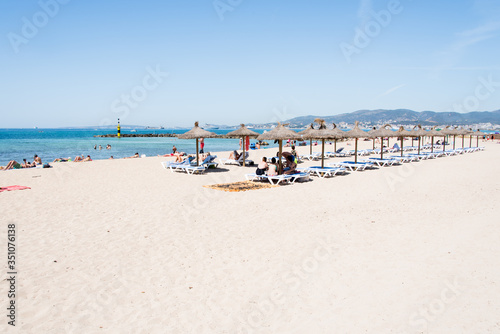 Fototapeta Naklejka Na Ścianę i Meble -  Beach with people and sea landscape in Ciudad Jardin, Majorca