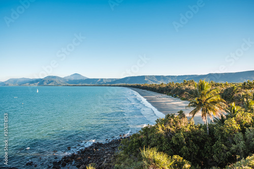 Aerial view on beach surrounded by mountains and trees in Australia