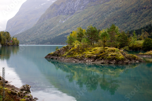 Beautiful norwegian landscape in autumn near Loen and Stryn in Norway.Lake with turquoise water surruonded by mountains.Lovatnet in autumn,photo for printing on calendar,poster,wallpaper,postcard