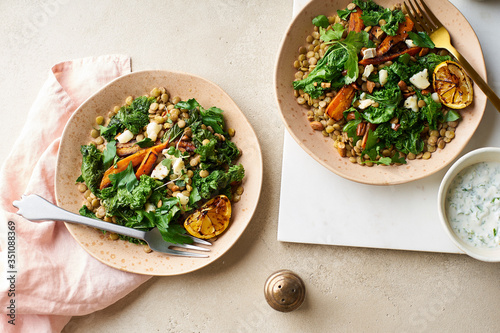 Vegetarian lunch, lentil salad with honey-roasted carrots, kale and goat cheese