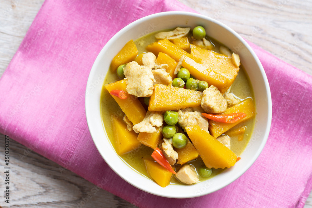 Homemade chicken curry with coconut milk and pumpkin on white bowl,Thai spicy style food. Homemade chicken curry with coconut milk and pumpkin on white bowl,Thai spicy style food.