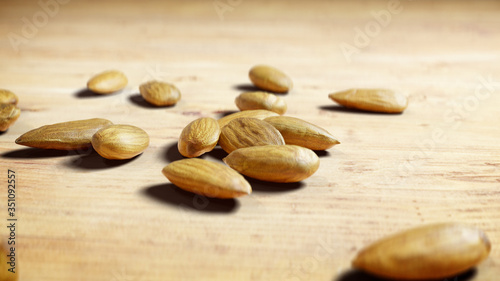 Close Up of Almonds on Wooden Table. Handful of Nuts