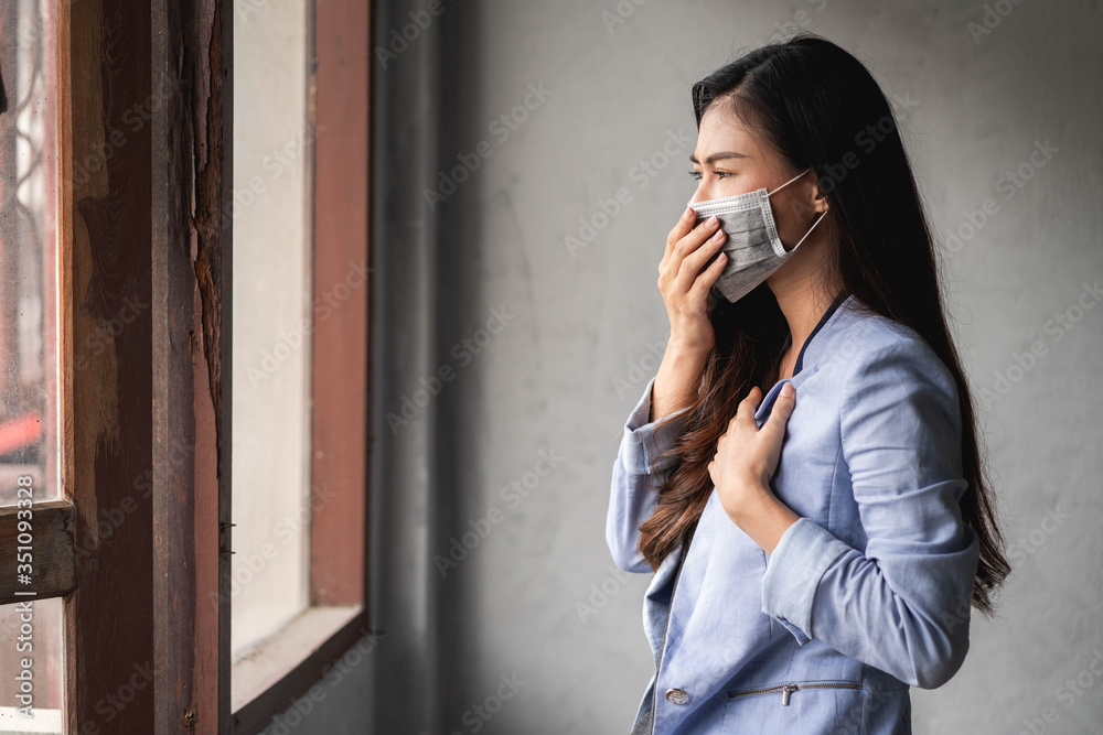 COVID-19 Pandemic Coronavirus, Asian woman have a cold and symptoms coughing, fever, headache and pains COVID-19 Pandemic Coronavirus, Asian woman have a cold and symptoms coughing, fever, headache and pains