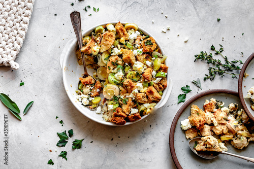 Goat cheese, leek and herb stuffing served onto a plate.