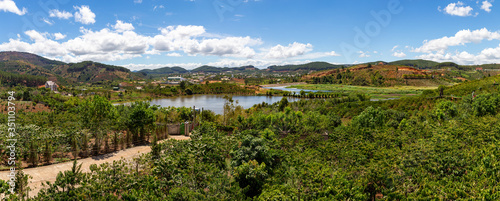 View of a lake surrounded by coffee plantations in Vietnam