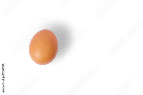 Chicken eggs with shadows and copy space on the right, isolated On a white background, Top view