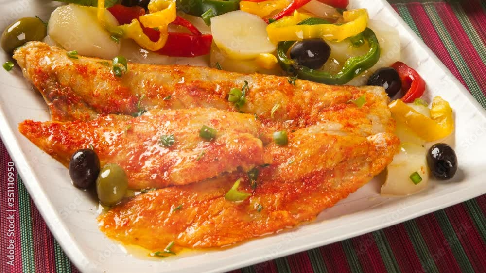 Moqueca, Fish stew with vegetables and black olive on the table. Moqueca, Fish stew with vegetables and black olive on the table.