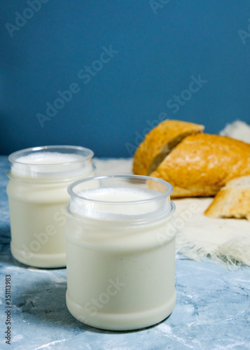 Two oat milk with a piece of bread