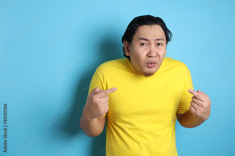 Asian Man Pointing Himself with Unhappy Expression Asian Man Pointing Himself with Unhappy Expression