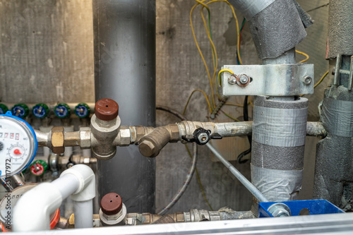 turn off hot water. plumbing cabinet. water meters, collector, water pressure sensor
