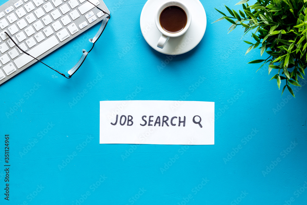 Job search. Blue office desk form above. Hiring concept Job search. Blue office desk form above. Hiring concept