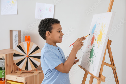 Cute African-American boy p...