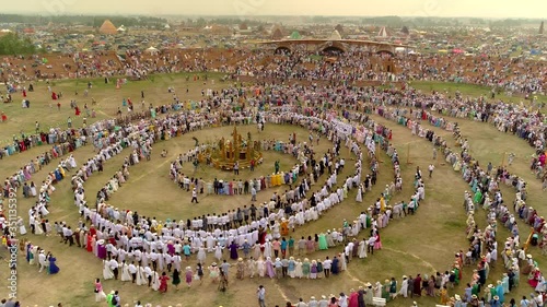 Ethnic Yakutia most important holiday of summer revival of nature. Traditional ritual folk tats epic dance. Round-robin circle religious cult Siberia. Many people in traditional costumes. Aerial photo