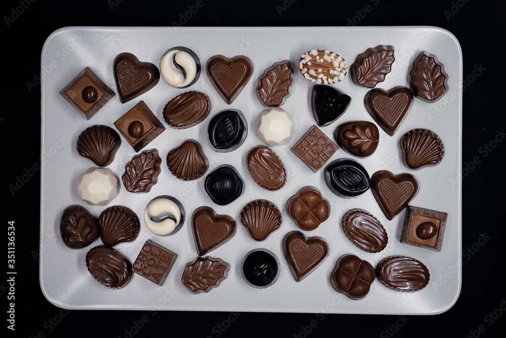 Traditional Turkish Candies designed on black surface with chocolate.Conceptual image of celebrations. Close-up chocolate. Religious Holiday, The Sugar Feast After Ramadan. Top view.
Traditional Turkish Candies designed on black surface with chocolate.Conceptual image of celebrations. Close-up chocolate. Religious Holiday, The Sugar Feast After Ramadan. Top view.