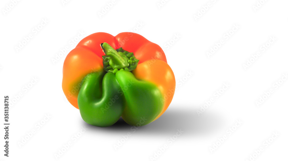 ugly yellow-green pepper of unusual shape on a white background, close-up, horizontal orientation, copy space. isolated ugly yellow-green pepper of unusual shape on a white background, close-up, horizontal orientation, copy space. isolated