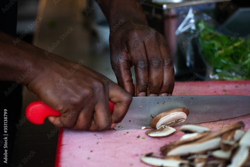 african american cutting vegetables in restaurant commercial kitchen
african american cutting vegetables in restaurant commercial kitchen