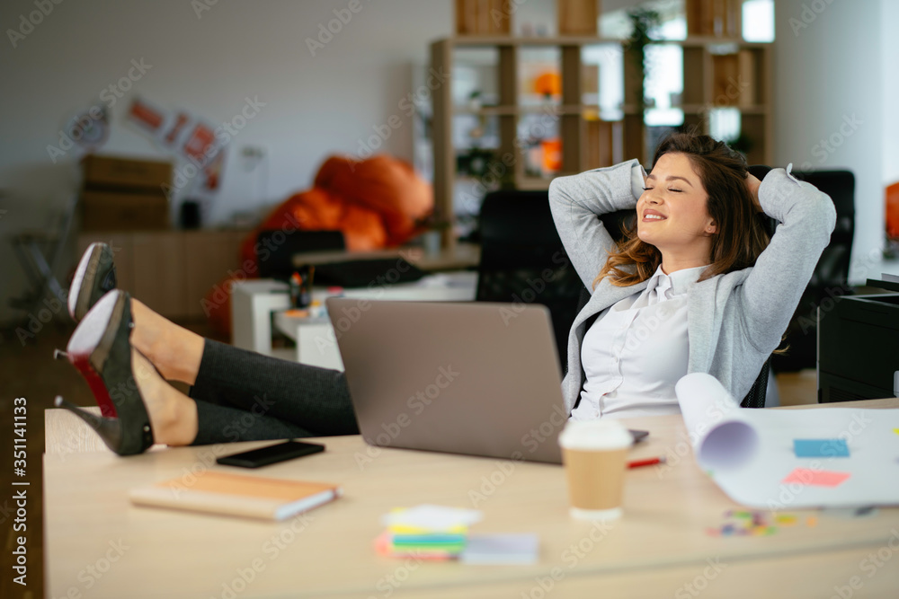 Beautiful young businesswoman working on project. Businesswoman in suit working in office. Beautiful young businesswoman working on project. Businesswoman in suit working in office.