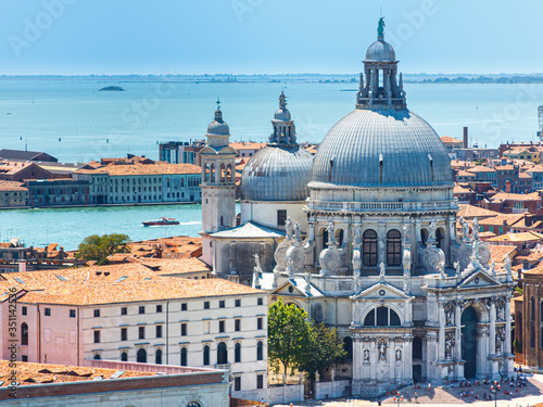 The church of Saint Mary of Health (Chiesa di Santa Maria della Salute) with its two domes and the campanile. Venice, Italy, Europe. photo
