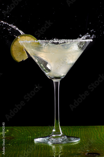 margarita cocktail in martini glass on a dark background