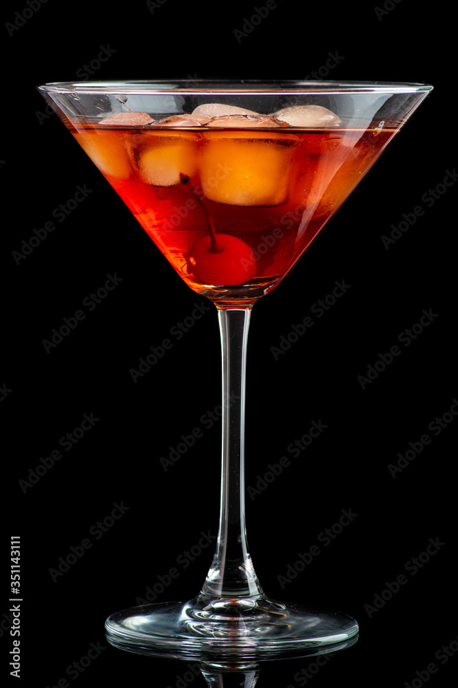 manhattan cocktail in martini glass on dark background manhattan cocktail in martini glass on dark background