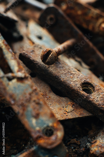 Scrap metal. Rusty screws, latches, curtain. Rust texture. Close-up. Macro. Corrosion of metal