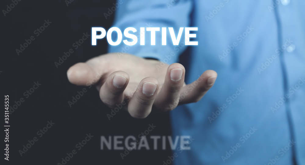 Man holding Positive and Negative words. Positive Man holding Positive and Negative words. Positive