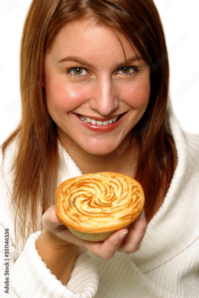 A woman holding up a Sheppard's pie
