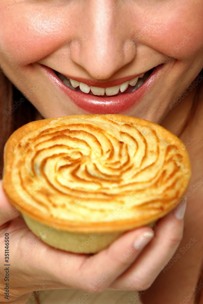 An up-close picture of a woman and a Sheppard's pie