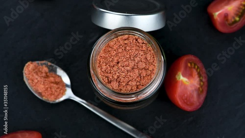 Tomato Powder on a rotating table (seamless loopable) photo