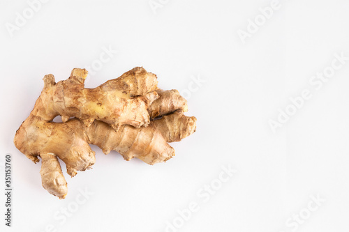 Ginger root on white background. Ginger used as spice for food and treatment in alternative medicine.