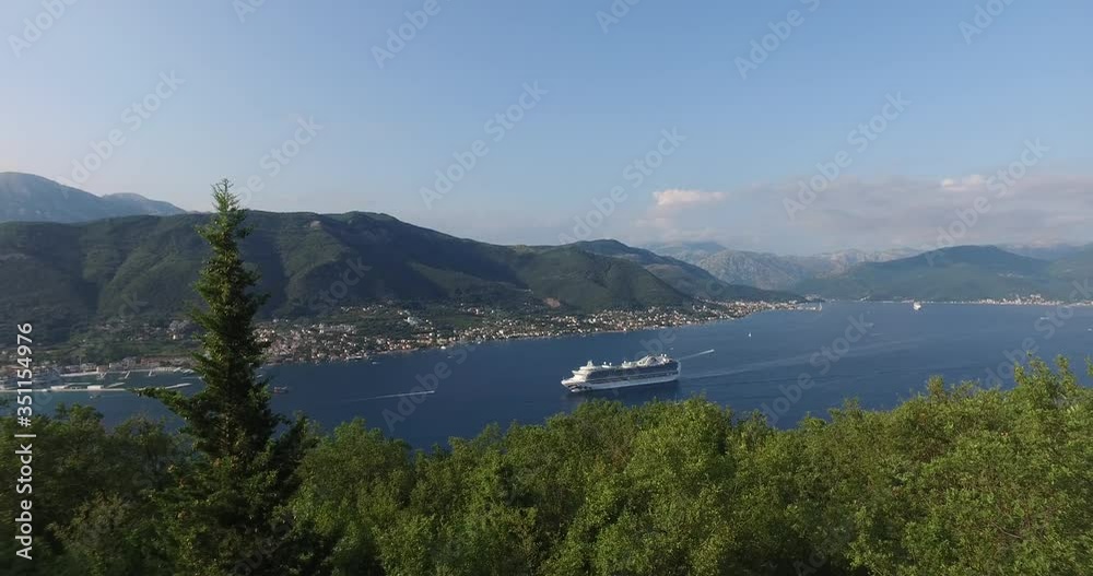 Panorama of Kotor bay while tourist cruise ship sailing - Emerald Princess - Princess Cruises - August 2019, Kotor bay (Boka Kotorska), Montenegro. Panorama of Kotor bay while tourist cruise ship sailing - Emerald Princess - Princess Cruises - August 2019, Kotor bay (Boka Kotorska), Montenegro.