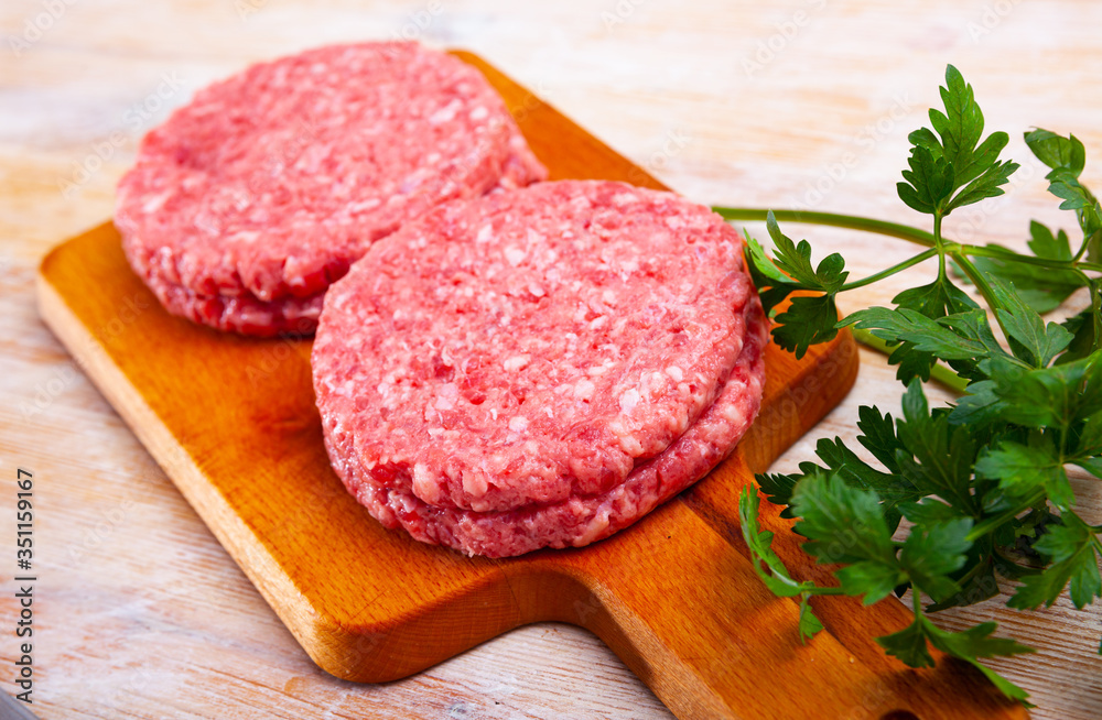 Raw minced beef patties for hamburgers